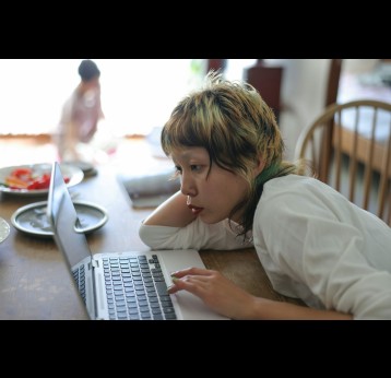 Young person working on a laptop. Credit: Kyonntra/ Getty Images