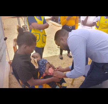 A mother holds her baby as they are given the malaria vaccine at Lumezi Urban Clinic. Credit: Temwanani Mtonga