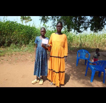 10-year-old Swail Fidaya with her mother. Credit: John Musenze
