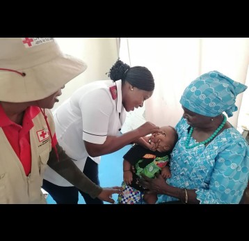 A nurse administering a dose of the oral polio vaccine to a minor at the Indira Gandhi Health Clinic in the Omusati region of northern Namibia. Credit: Namibia Ministry of Health and Social Services