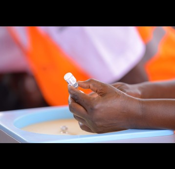 A vial containing the malaria vaccine. The vaccine, rolled out in Uganda in April 2025, has averted tens of thousands of cases of severe malaria in the east African country. Credit: Path Uganda