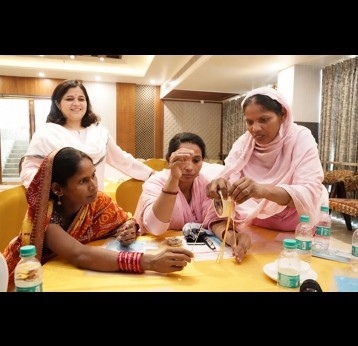 Caregivers and health workers engaged in co-creation workshop activities. Credit: JSI
