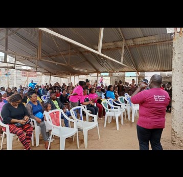 A cervical cancer survivor addresses girls and women at Kariobangi Primary and Nursery School in Nairobi. Credit: Victoria Amunga