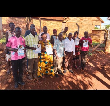 Community members from Kagoma south ward pose for a photo after an awareness campaign against meningitis in the area. Credit: Bountiful Missions Uganda