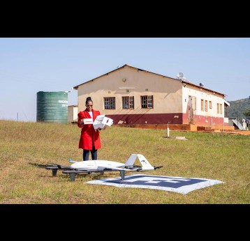 Health worker receives drone-delivered medications in Eswatini. Credit: Nkwe
