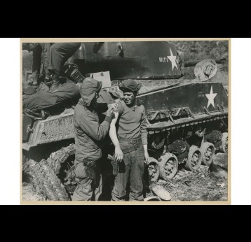 Medic gives a shot to soldier near front line (SC 361229), National Museum of Health and Medicine