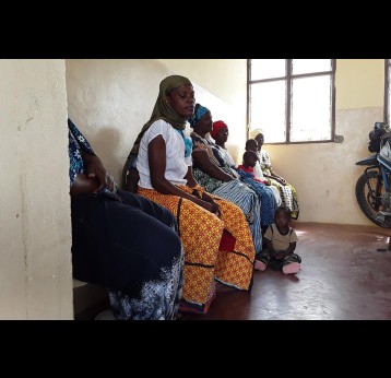 Women and children waiting for services at Yapha Dispensary in Kwale county. The clinic serves five villages. Credit: Joyce Chimbi