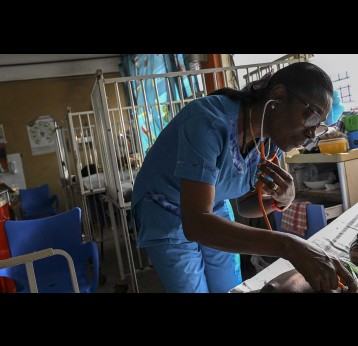 Dr. Mame Yaa Nyarko, director of the Accra Children's Hospital, examines a young patient.