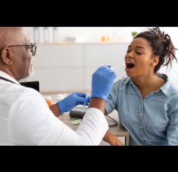 A cheek swab can reveal inherited genetic variants that may influence how someone responds to certain medicines. Prostock-studio/Shutterstock