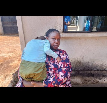 Joshua’s mother holds him outside their home in Busia County, Kenya. Children with disabilities, like Joshua, often go unvaccinated or unsupported by the health system. Recent efforts in Kenya have worked to ensure Joshua and others receive their routine immunisations. Photo credit: PATH/Peter Abwao