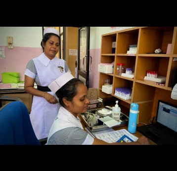 Nursing Officer-in-Charge Amali Nisansala supervises blood sample collection at the National STDAIDS Control Programme. Credit: Aanya Wipulasena