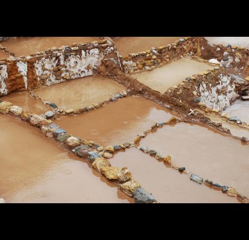 Peru's Maras Salt Mines. Scientists have estimated that extreme rainfall was responsible for over 20,000 infections during Peru’s 2023 dengue outbreak. Photo by Zach Kirby on Unsplash