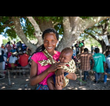 A mother and her child at a community health outreach session in a rural area north-west of Maputo. Credit: Gavi/2020/Svetlomir Slavchev