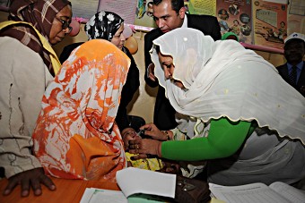 Dr. Amani Abdelmoniem Mustafa delivers the rotavirus vaccine to a child in Sudan.