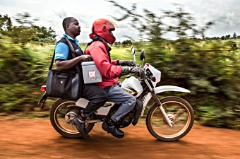 Vaccines being delivered by motorcycle in rural Kenya.