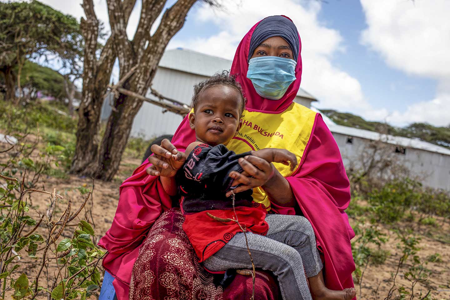 A young girl waits to be vaccinated during national polio and measles vaccination campaign in Mogadishu, Somalia on Tuesday 01 September 2020. Photo Ismail Taxta / Ildoog/WHO SOMALIA