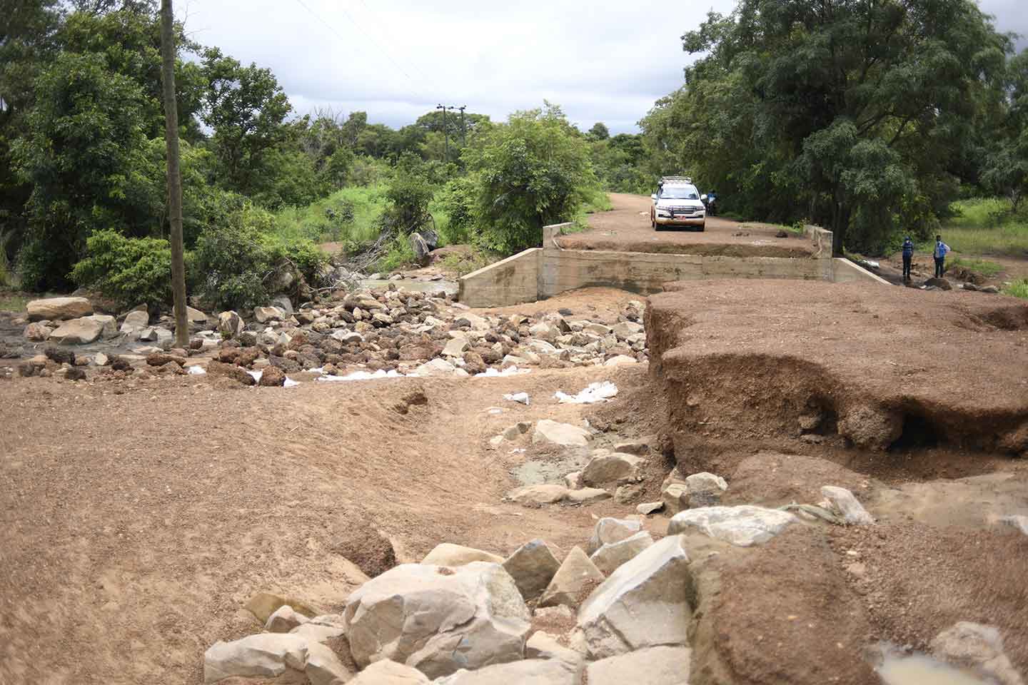 A UNICEF team in Tumu in the Upper West Region seeks alternative routes to reach children when they come across an unmotorable road on 11 September 2020. ©UNICEF/BUTA
