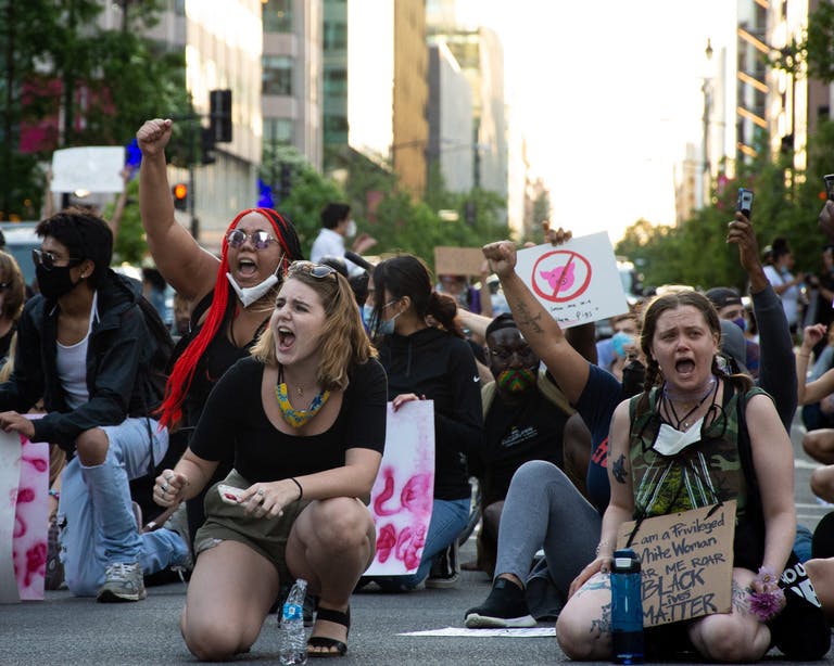 Young people attend a protest in Washington, D.C. during the COVID-19 pandemic.