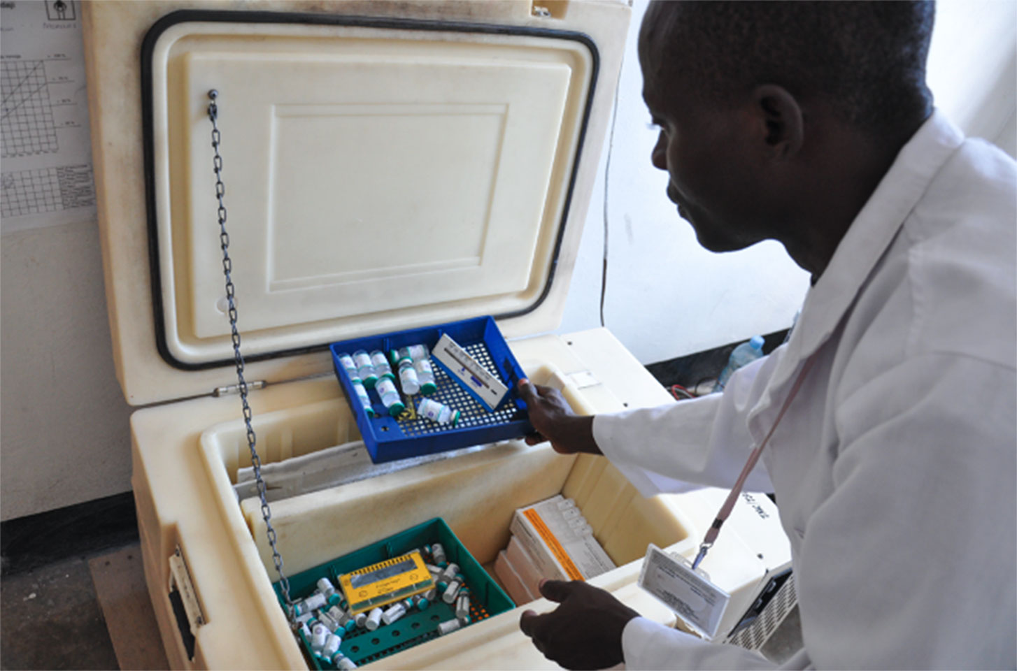Vaccine product characteristics vary widely. Differences in volume, number of doses, and cold storage requirements—like the refrigerator shown here at Kimbiji Health Center in Tanzania – can have a big impact on cost. Photo: PATH/Doune Porter.
