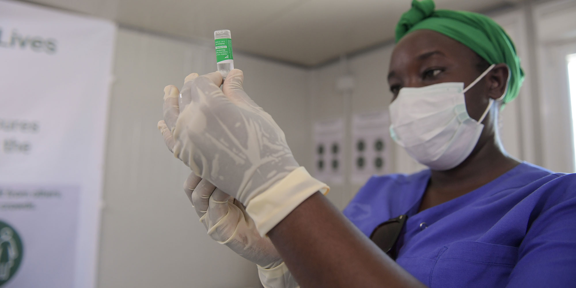  A medical officer prepares to administer the COVID-19 vaccine. Copyright: AMISOM Photo/Mokhtar Mohamed, Public Domain