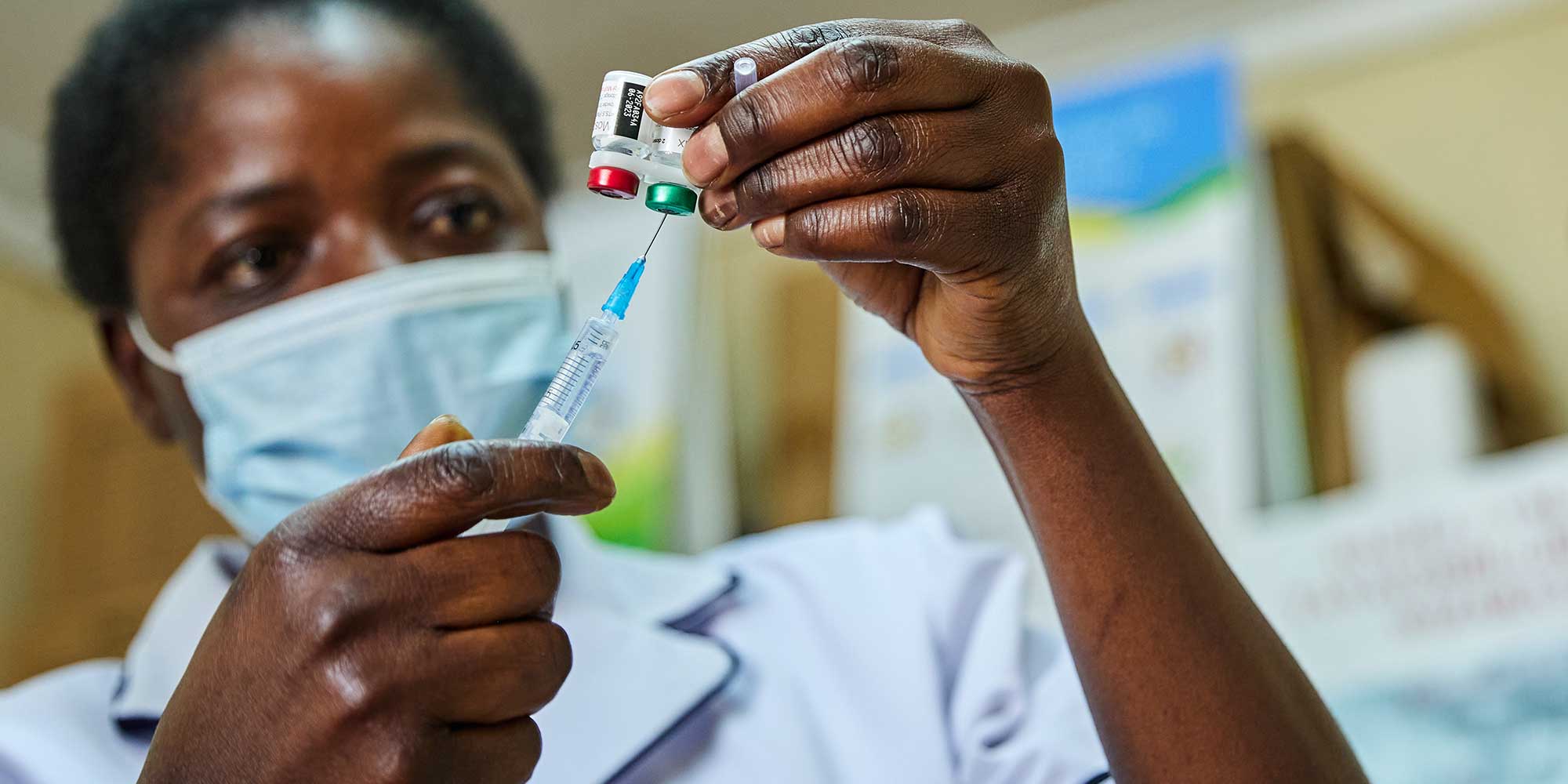 Nurse Janet Wanyama prepares to vaccinate a child against malaria at the Malava County Hospital, Kakamega, Kenya. Credit: Gavi/2021/White Rhino Films-Lameck Orina
