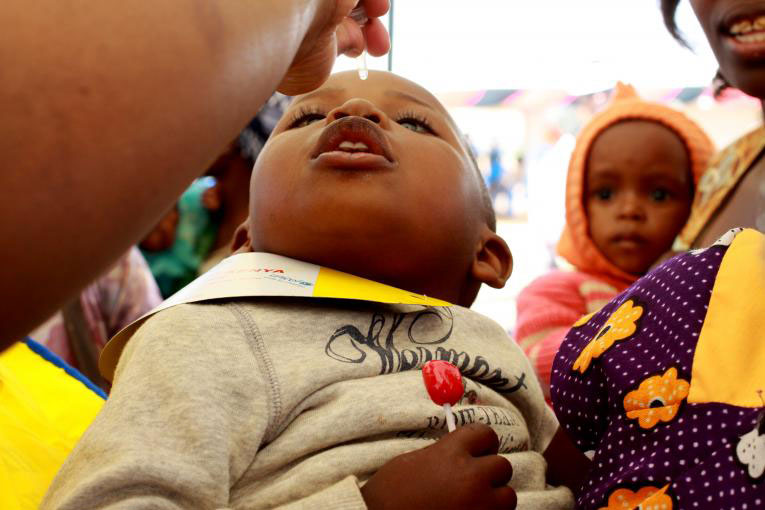 Child receiving an oral polio vaccine Photo Courtesy unicef.org