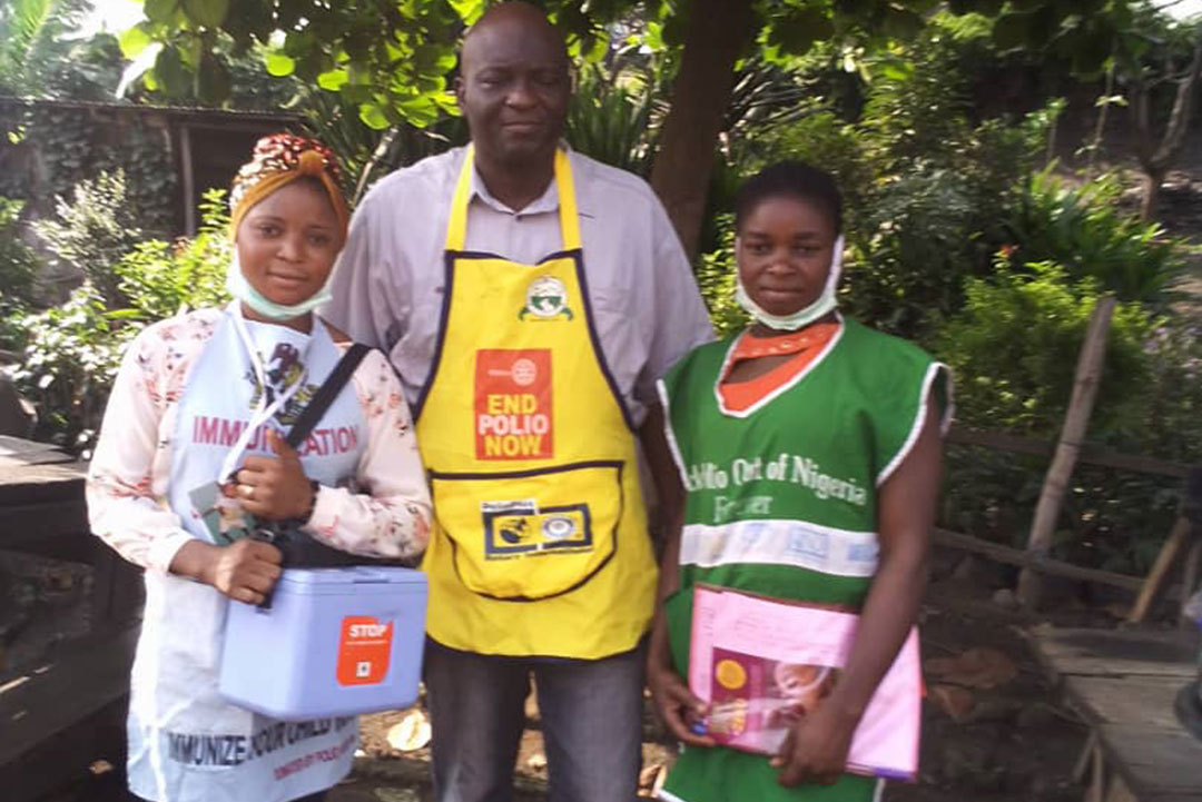 Awofeso Rasheed at the middle, with vaccinator and supervisor