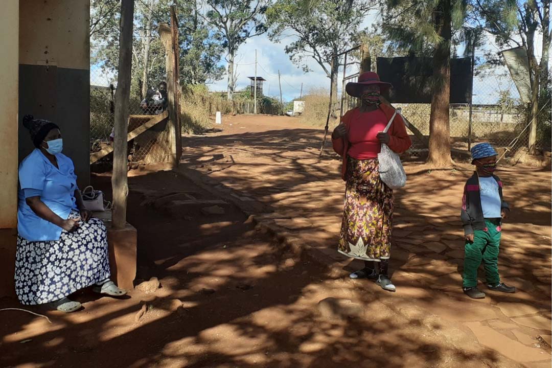 Betty Maseko interacting with a community member during the immunisation programme at Lomahasha clinic. Credit: Nonduduzo Kunene