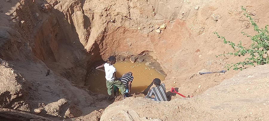 Community members try to preserve the remaining water reserve in Kalacha border town in Marsabit, Kenya