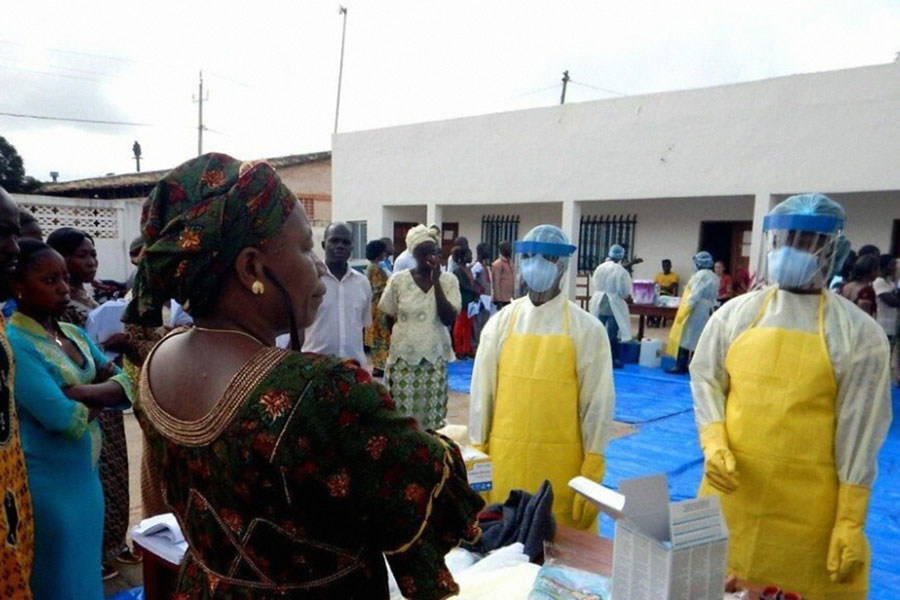 Staff wear protective gear at an Ebola treatment centre in Guinea. Copyright: CDC Global Health (CC BY 2.0)