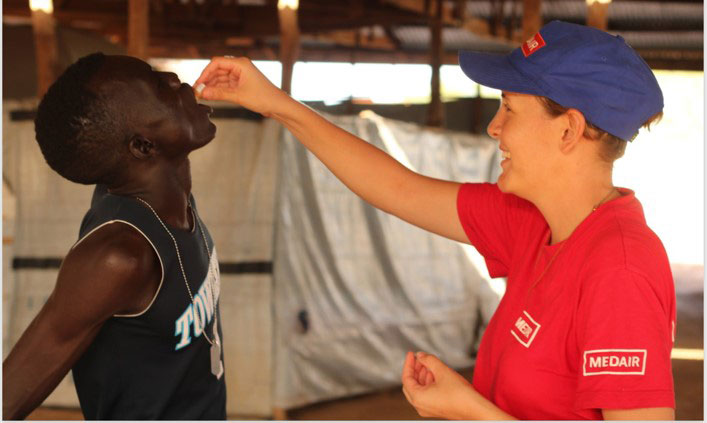 Emma Symons, MEDAIR Project Manager, administers a cholera vaccine in Mingkaman, South Sudan By Diana Gorter