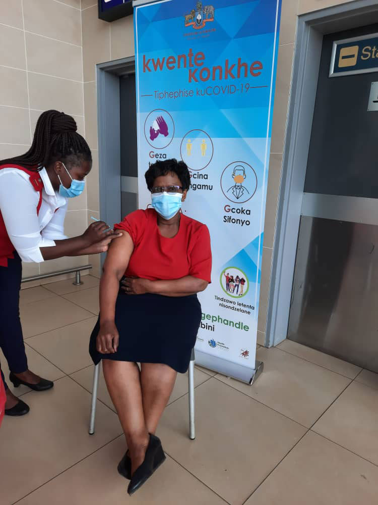 Matron Sibongile Simelane getting her first dose of AstraZeneca vaccine courtesy of COVAX initiative.