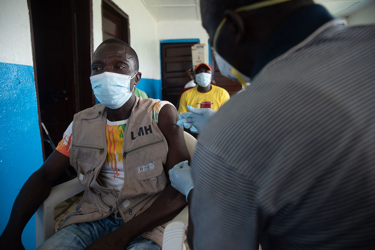 A Last Mile Health worker is vaccinated against COVID-19 in Liberia Credit: Last Mile Health