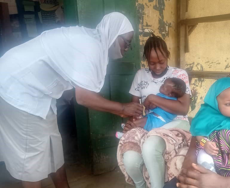 Mrs Oluwapelumi Afolabi and her son at the Agugu PHC