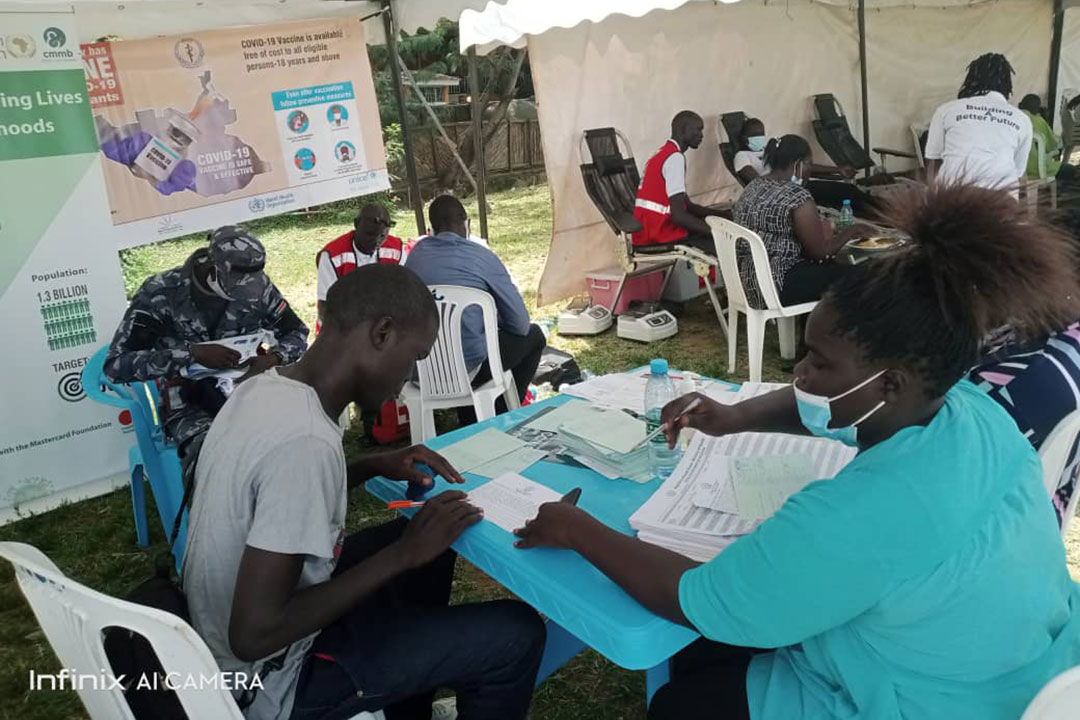 Health workers taking COVID-19 vaccination records at Nyakuron Cultural Centre – by Simon Deng