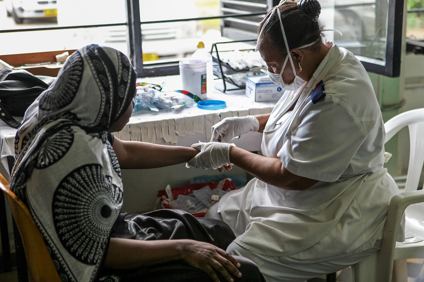 Nurse administering injection. – Credit: Gavi/2012/Sala Lewis