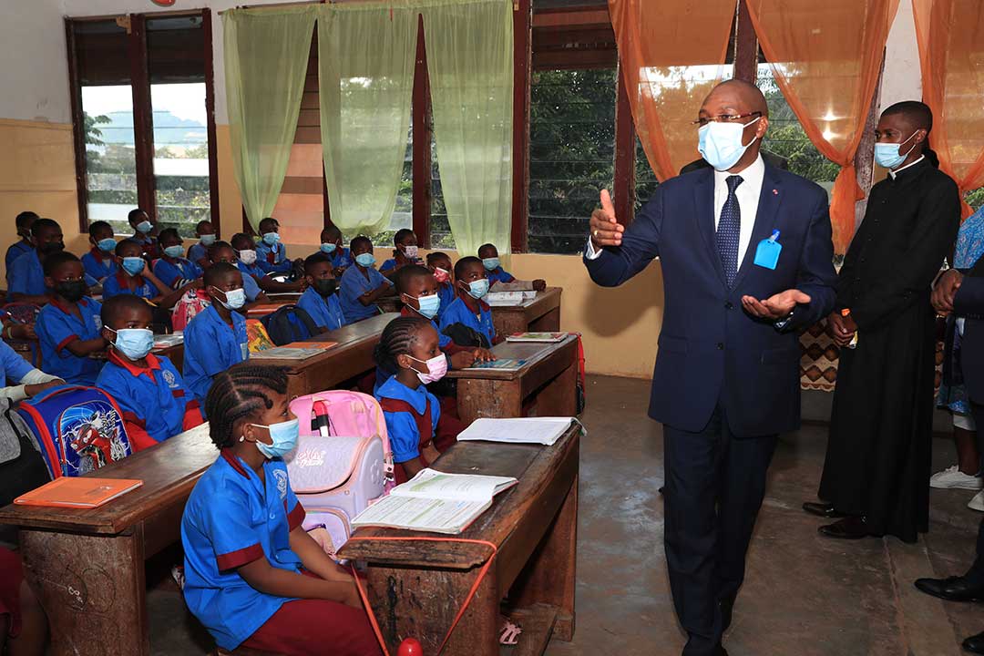 Cameroon's Public Health Minister, Malachie Manaouda, tells students to educate their parents about the vaccine during a tour of schools in Yaounde.