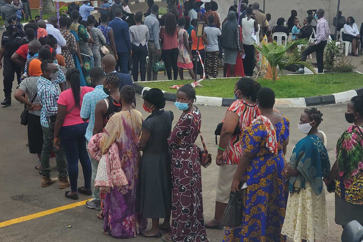 Kampala residents line up to receive COVID-19 vaccinations at the Ministry of Health headquarters in June 2021. The outreach is an initiative by the Ministry to get more people vaccinated outside health facilities. Photo by Evelyn Lirri