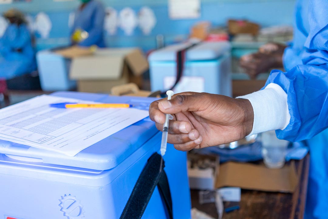 A health worker prepares the typhoid conjugate vaccine (TCV) injection