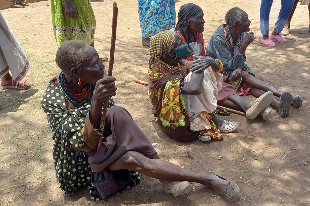 Villagers in Logloko village, Marsabit, listening to COVID-19 vaccine education and information sharing session.