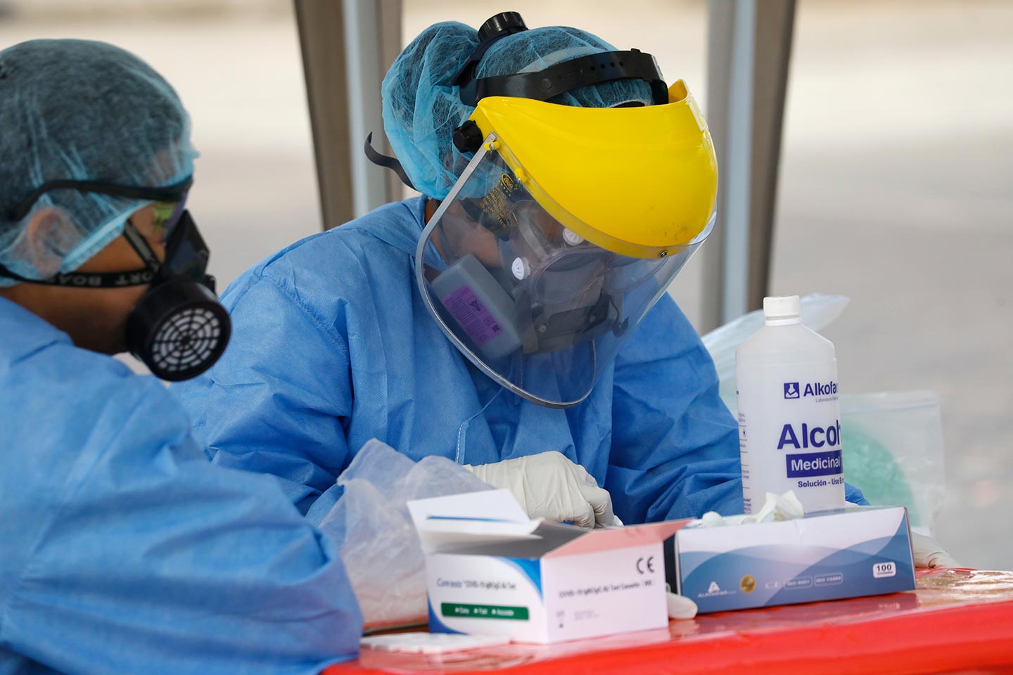 Lima, Peru; may 14,2020: Healthcare workers check blood sample for a rapid diagnostic tests of new coronavirus disease. Credit: Angelica Zari