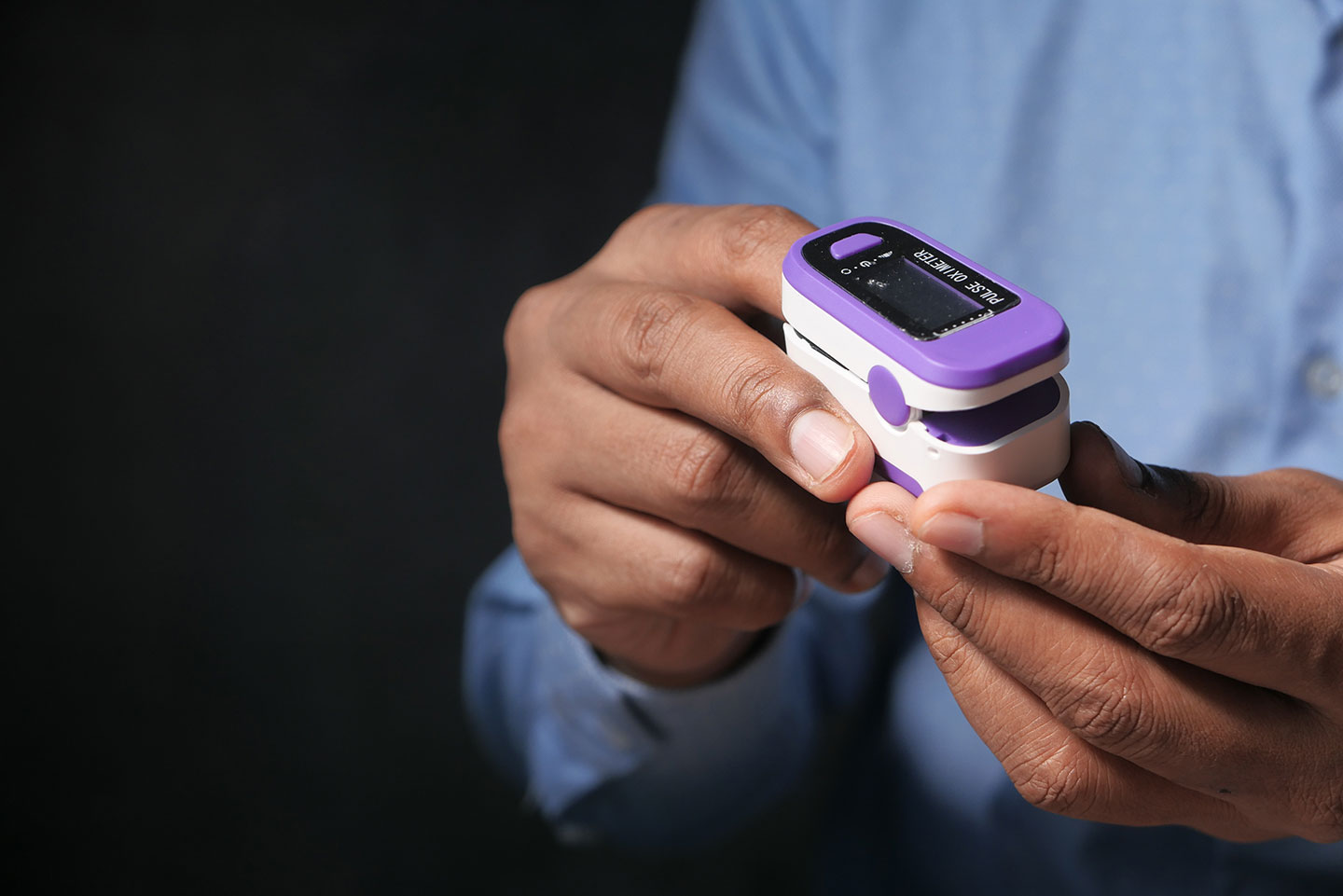 Patient using pulse oximeter