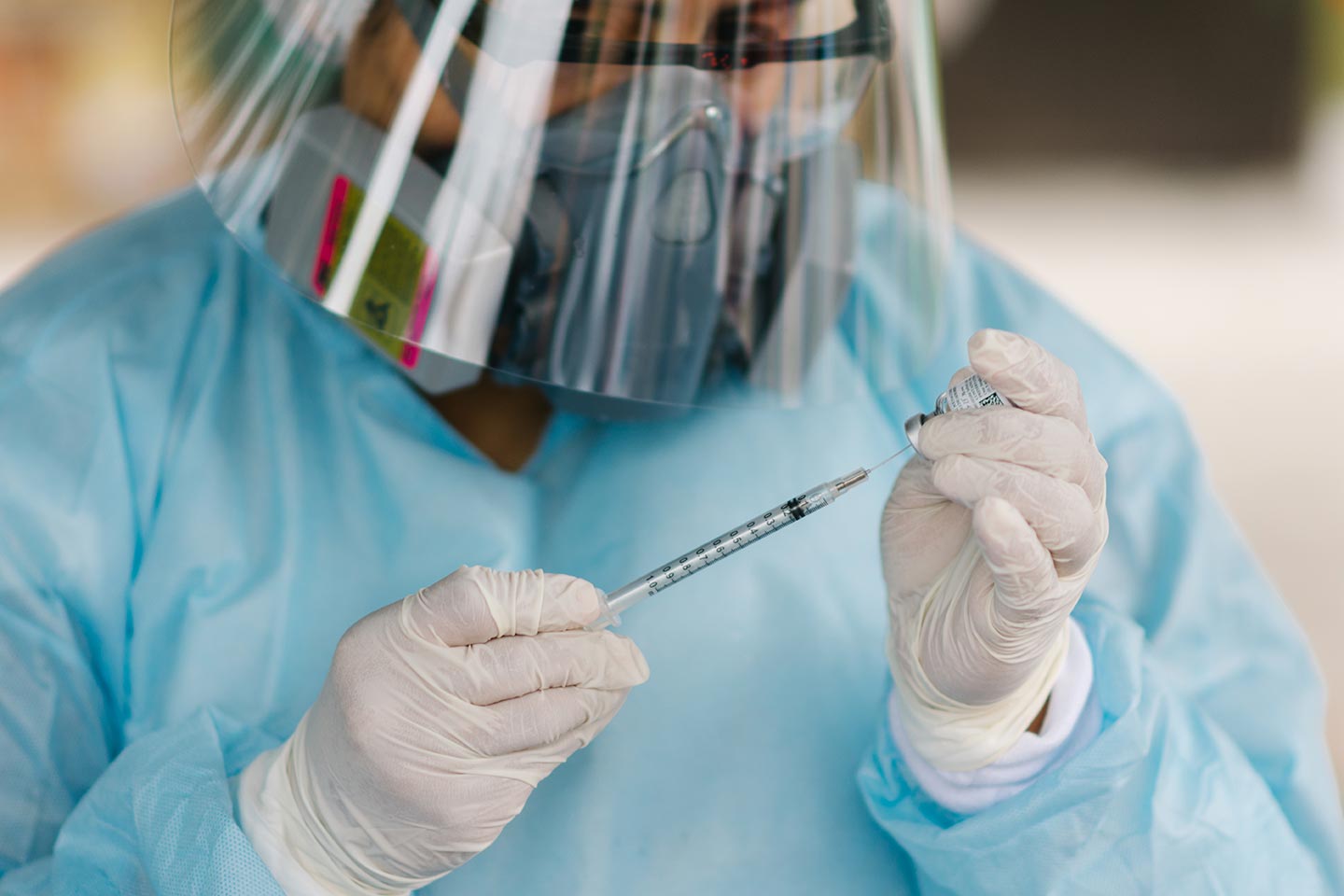 Callao, Lima-Perú-November, 7, 2020- selective focus a nurse protected against the coronavirus prepared a dose of diphtheria vaccine in Peru's national campaign against diphtheria