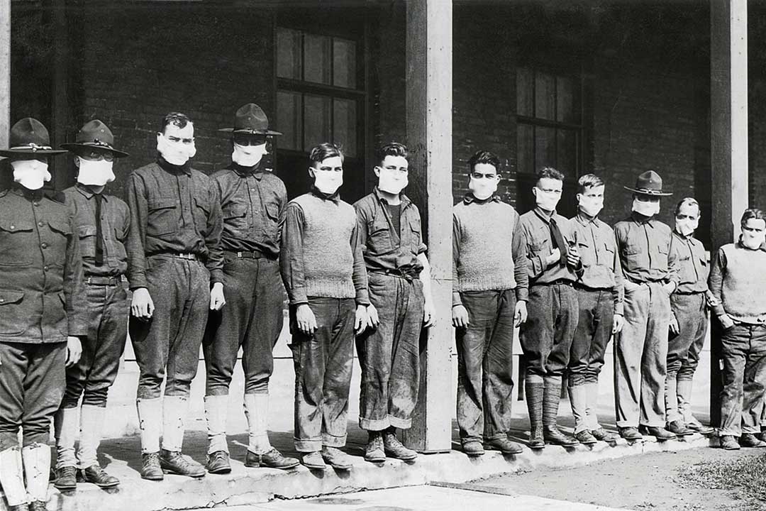 Men wearing masks outside a military hospital in New York during the 1918 influenza pandemic.