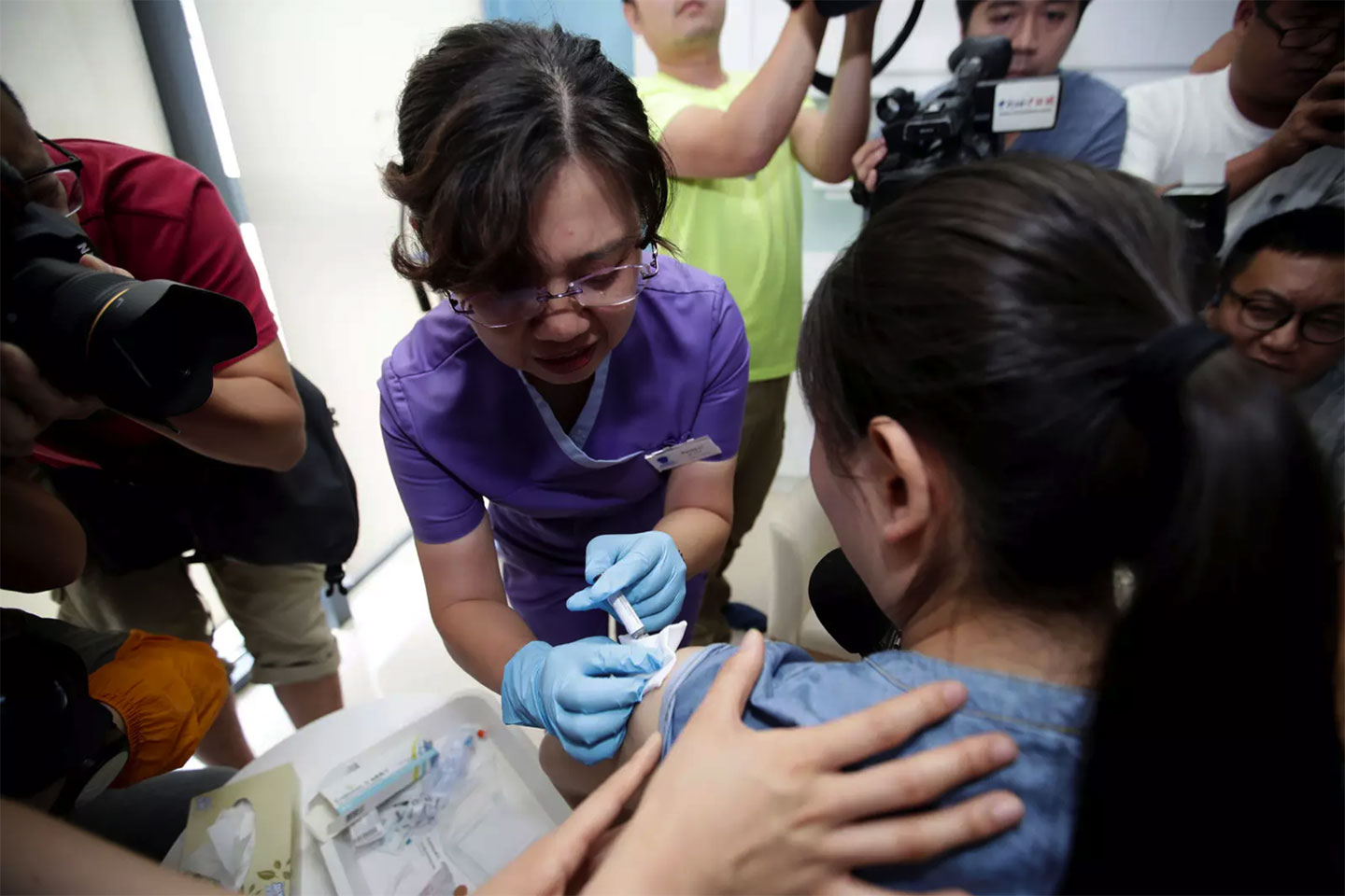 Woman in China receiving the HPV vaccine. Image: REUTERS/Stringer.