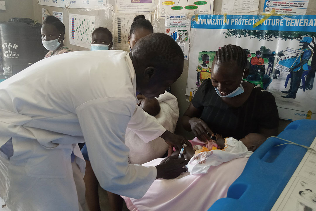 A health worker vaccinating a baby at Munuki Health Center. Credit: Winnie Cirino