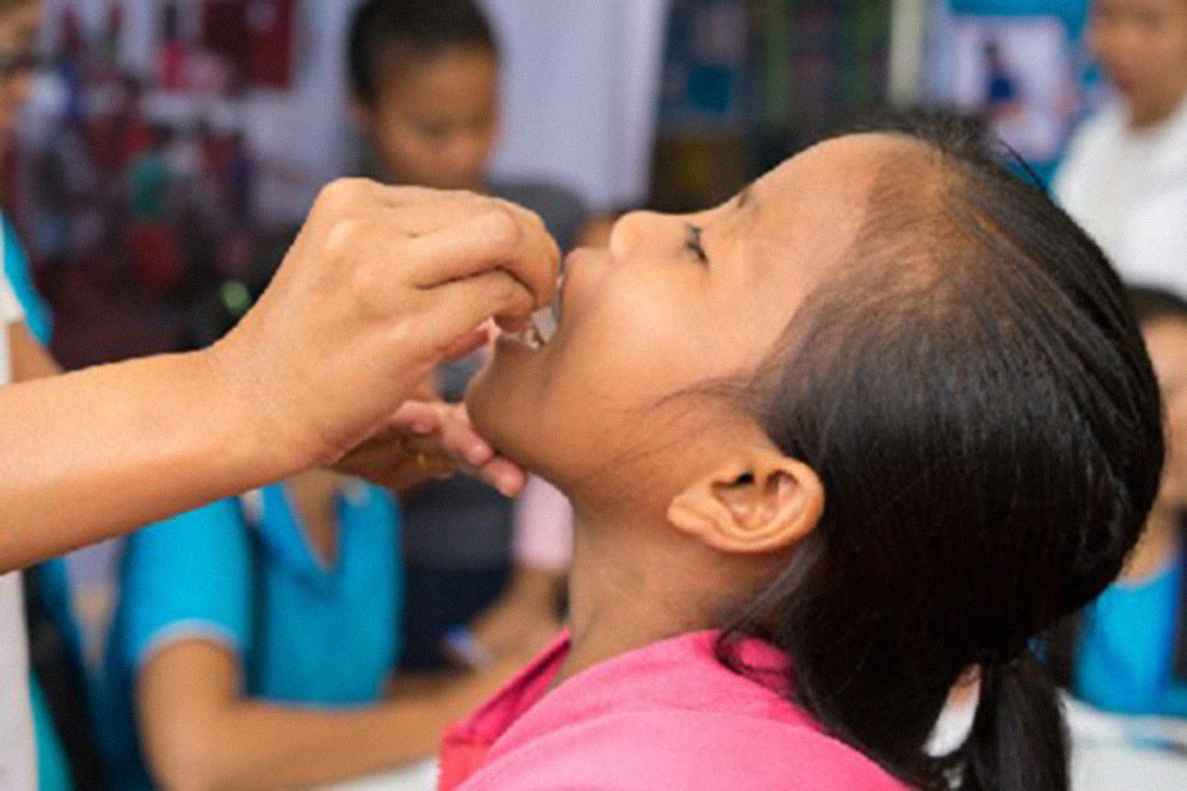 A young girl receives a dose of Gavi-donated oral cholera vaccine in Sanamxay District, Laos