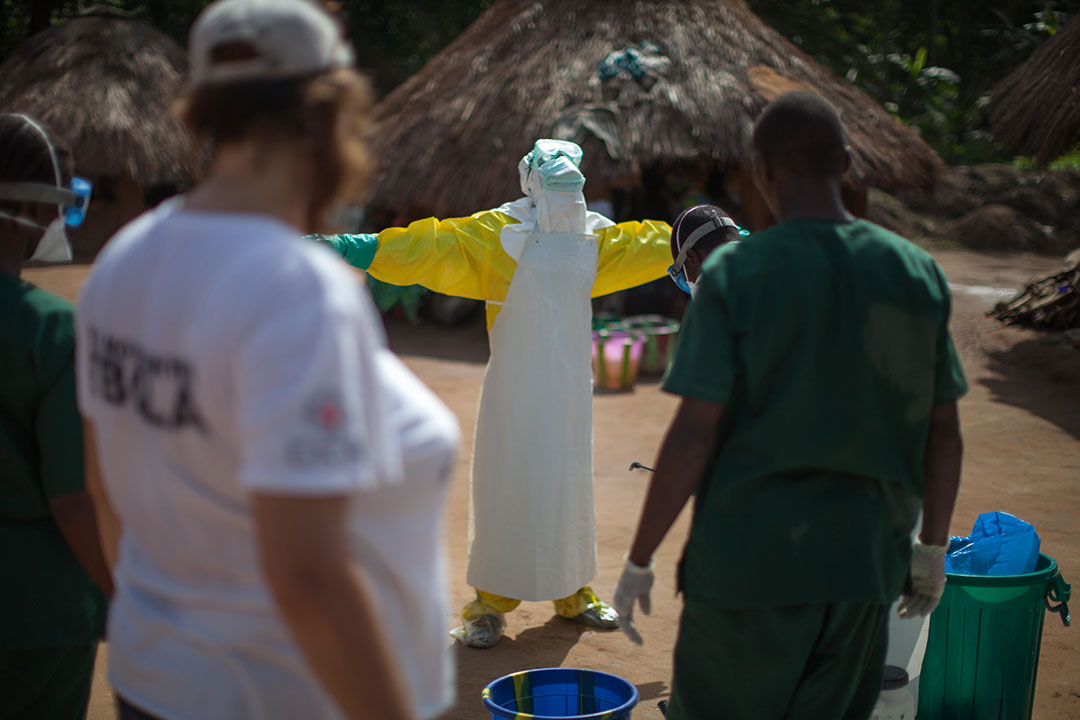 Health workers don full personal protective equipment in Guinea during the 2014-16 West Africa Ebola outbreak. Credit: Sean Hawkey