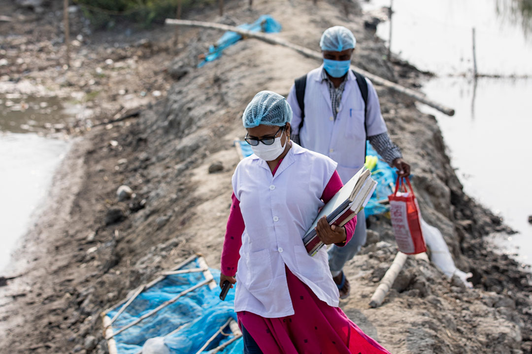 Nurses walking back from a vaccination point. Credit: Gavi/2022/Benedikt v.Loebell