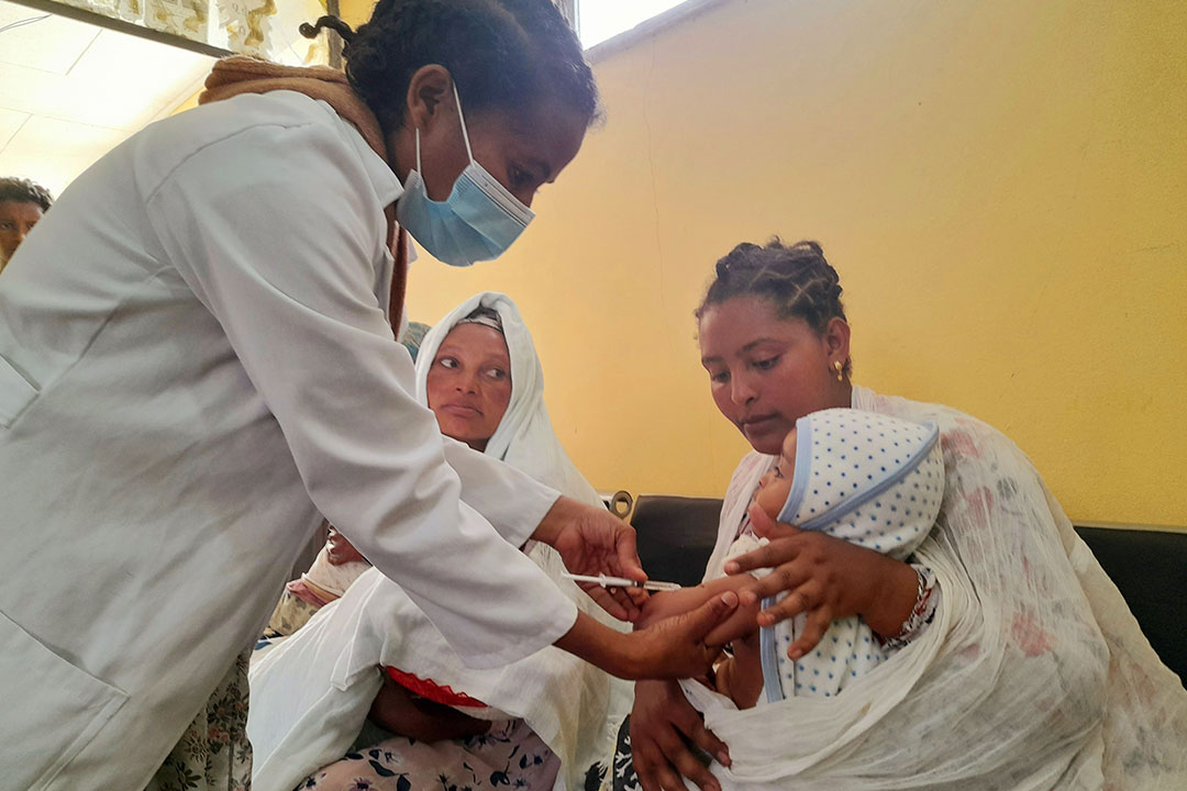 Shashework Tilahun, takes her daughter to get her routine immunisation. Credit: Solomon Yimer